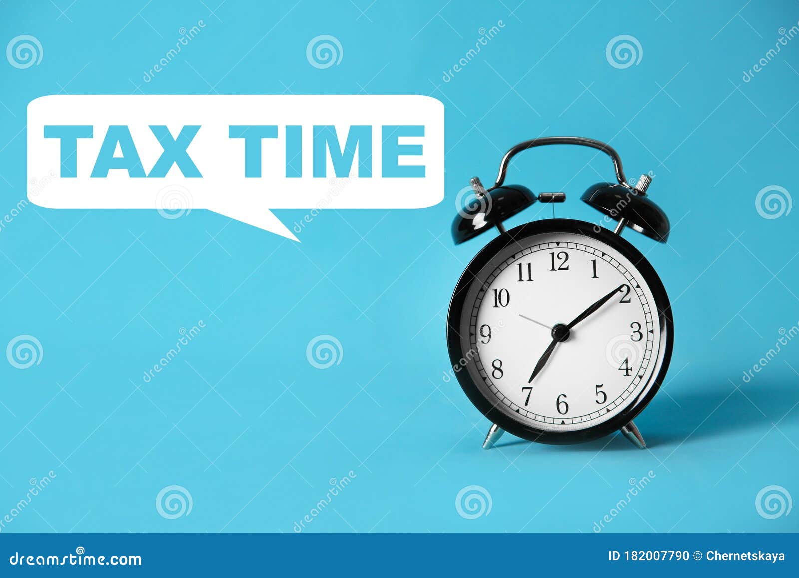 Time To Pay Taxes. Alarm Clock on Blue Background Stock Photo Image
