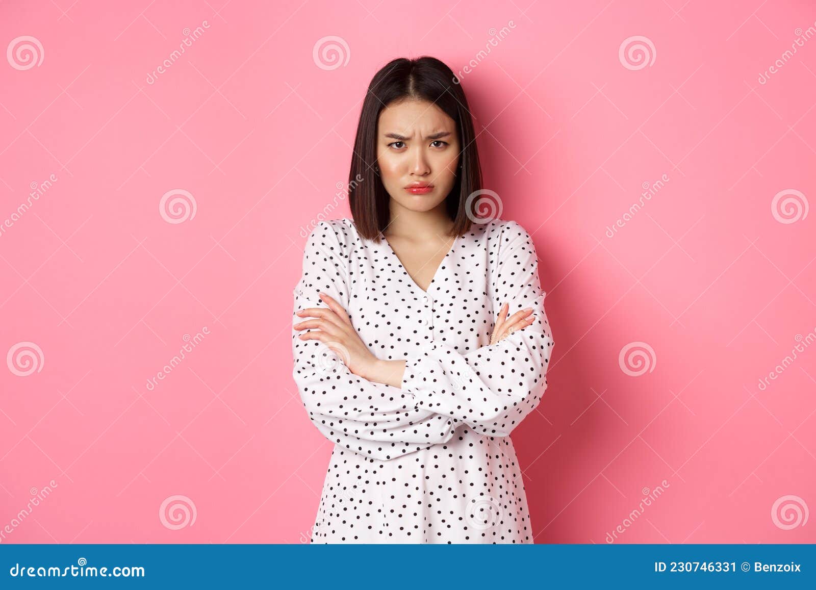 Timid and Offended Asian Girl Cross Arms on Chest, Staring Defensive ...