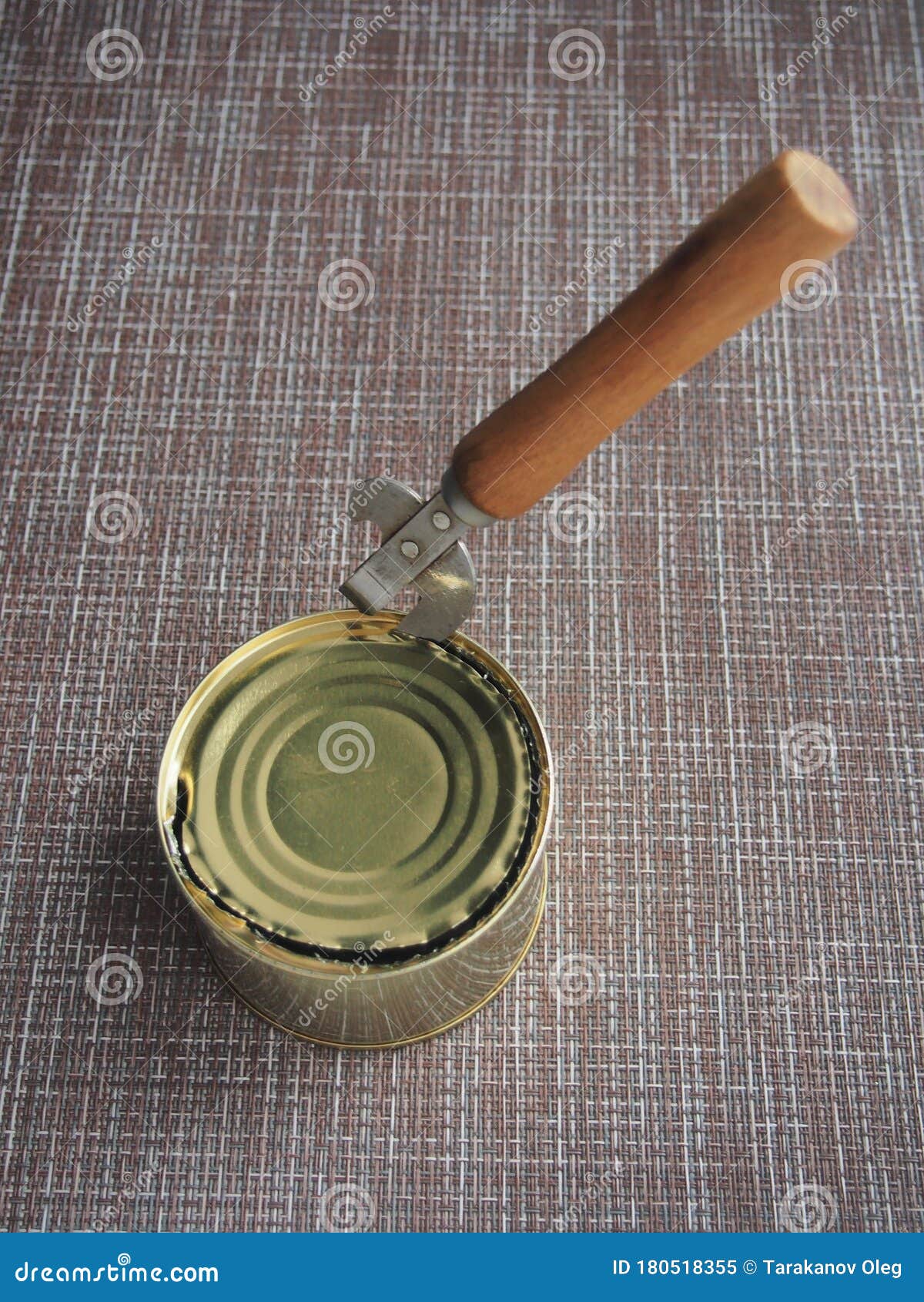 A Tin Can and a Can Opener. the Opening of the Cans Stock Image Image