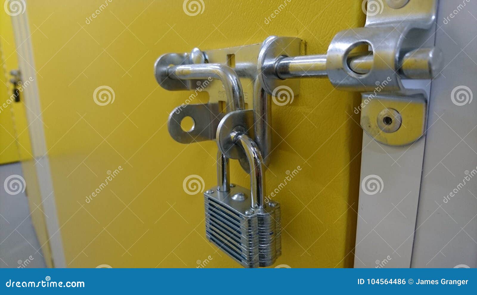 A Close Up Of An Aluminium Padlock And Door Bolt On A Storage Unit