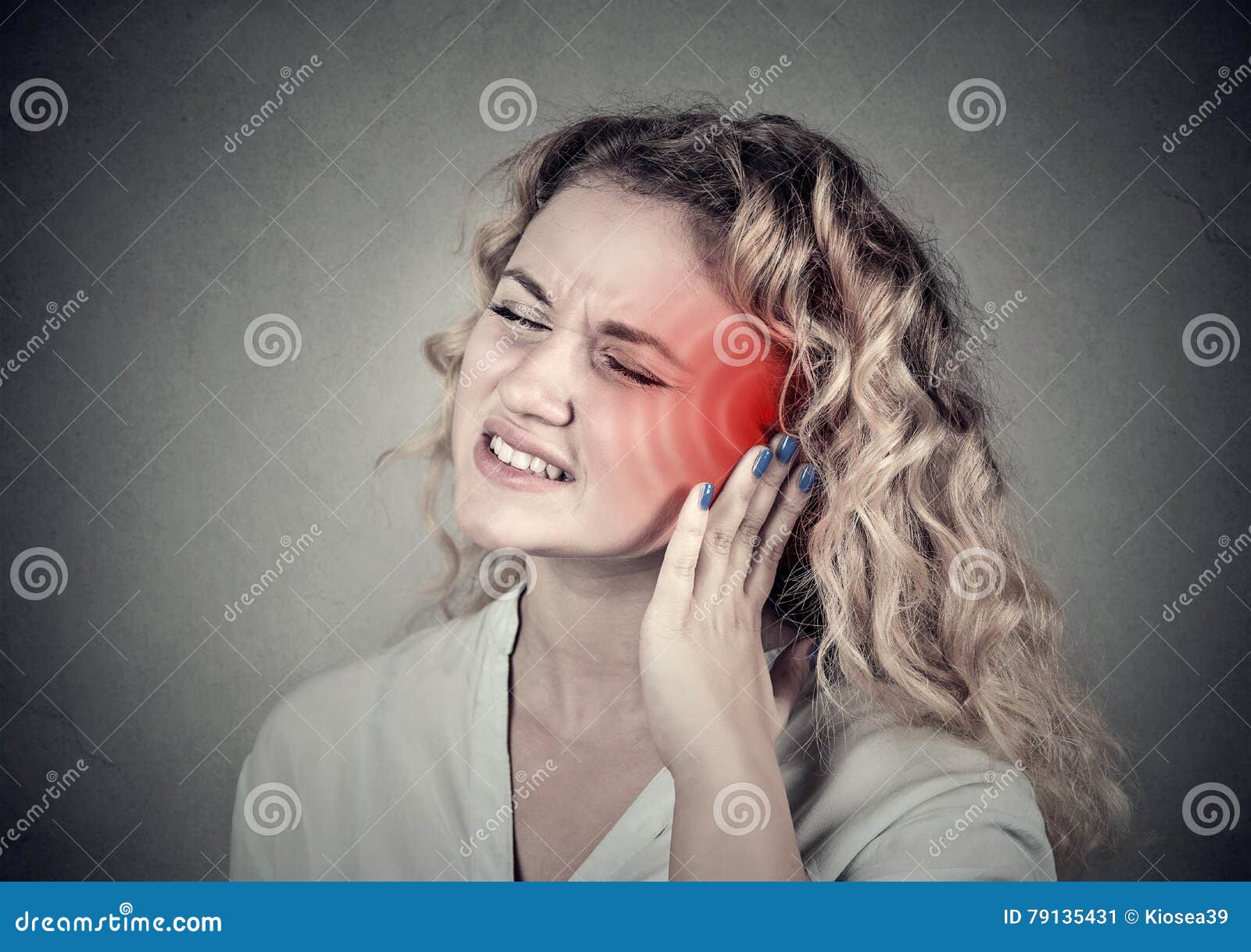 tinnitus. sick female having ear pain touching her painful head
