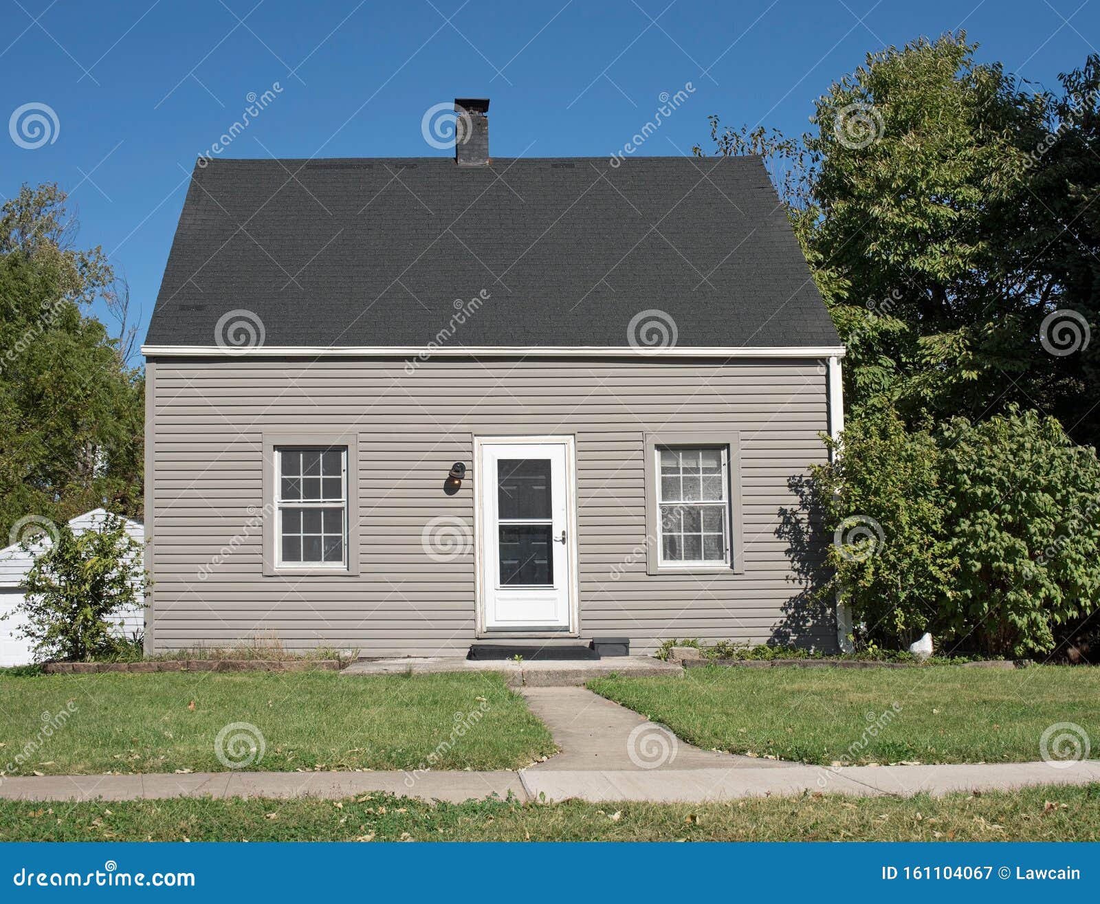 tiny gray low income house