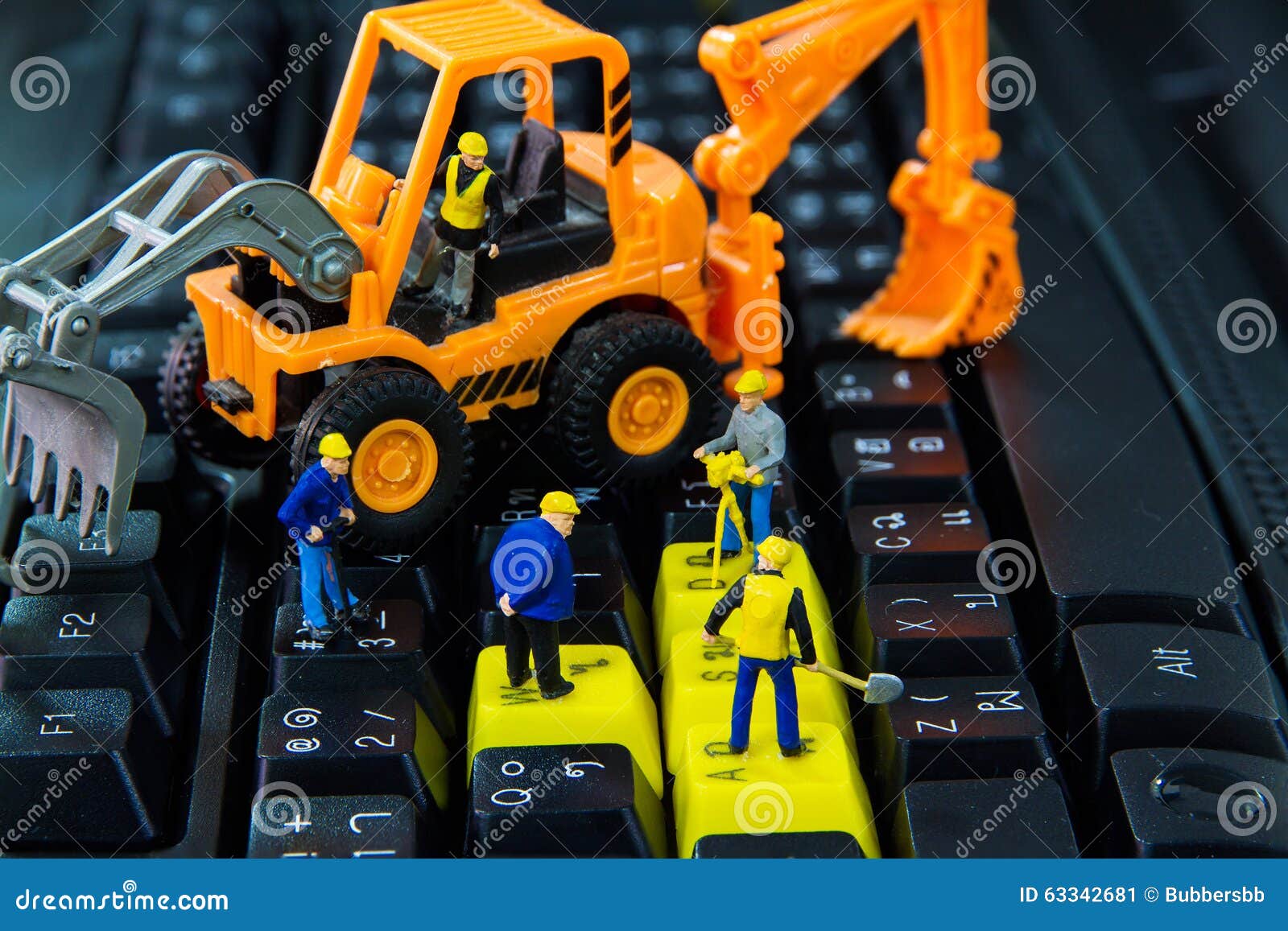 Tiny Toys Workers Repair Work on the Computer Keyboard Stock Image