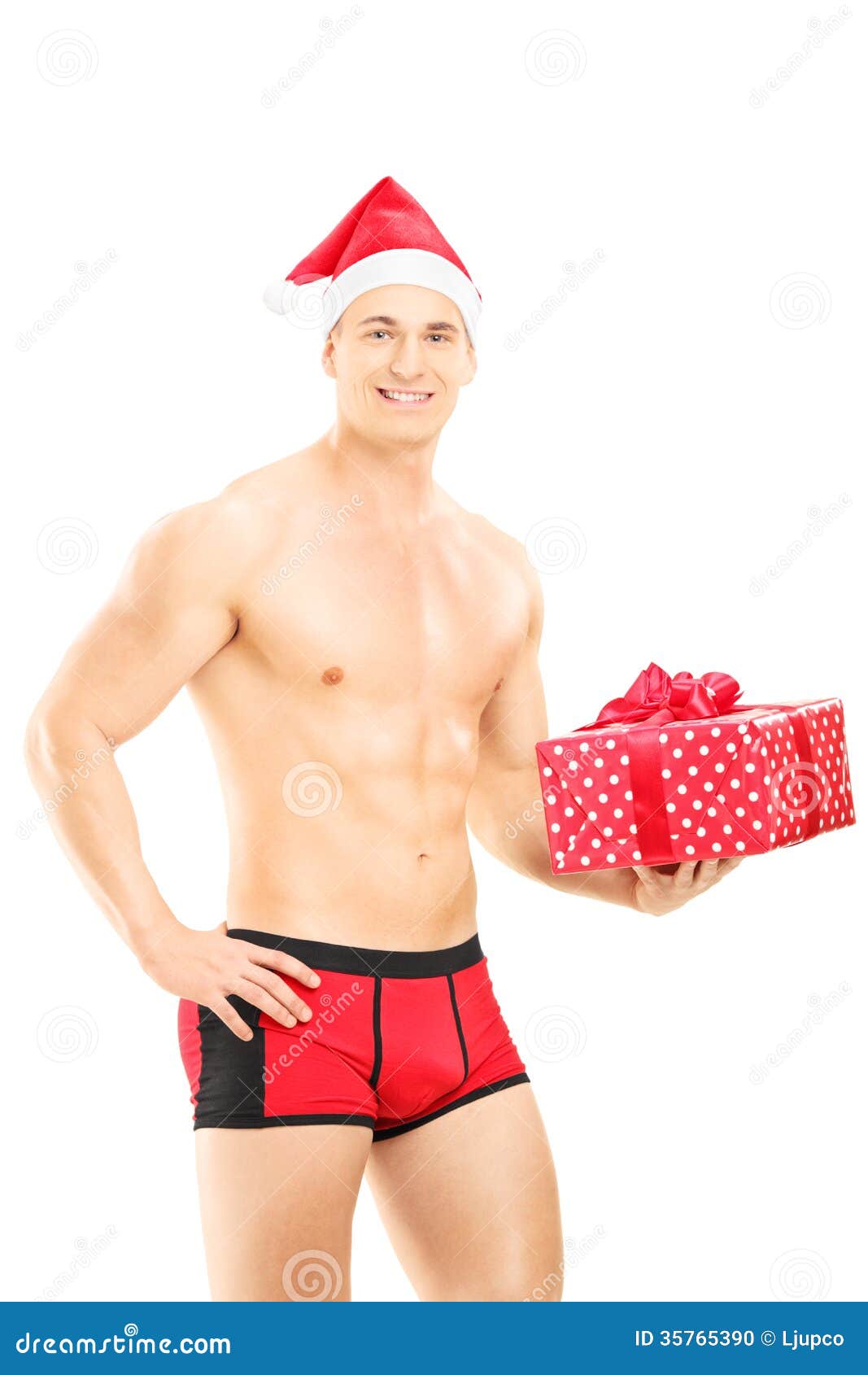 Tipo Bello Che Porta Le Mutande Rosse Ed Il Cappello Di Natale Che