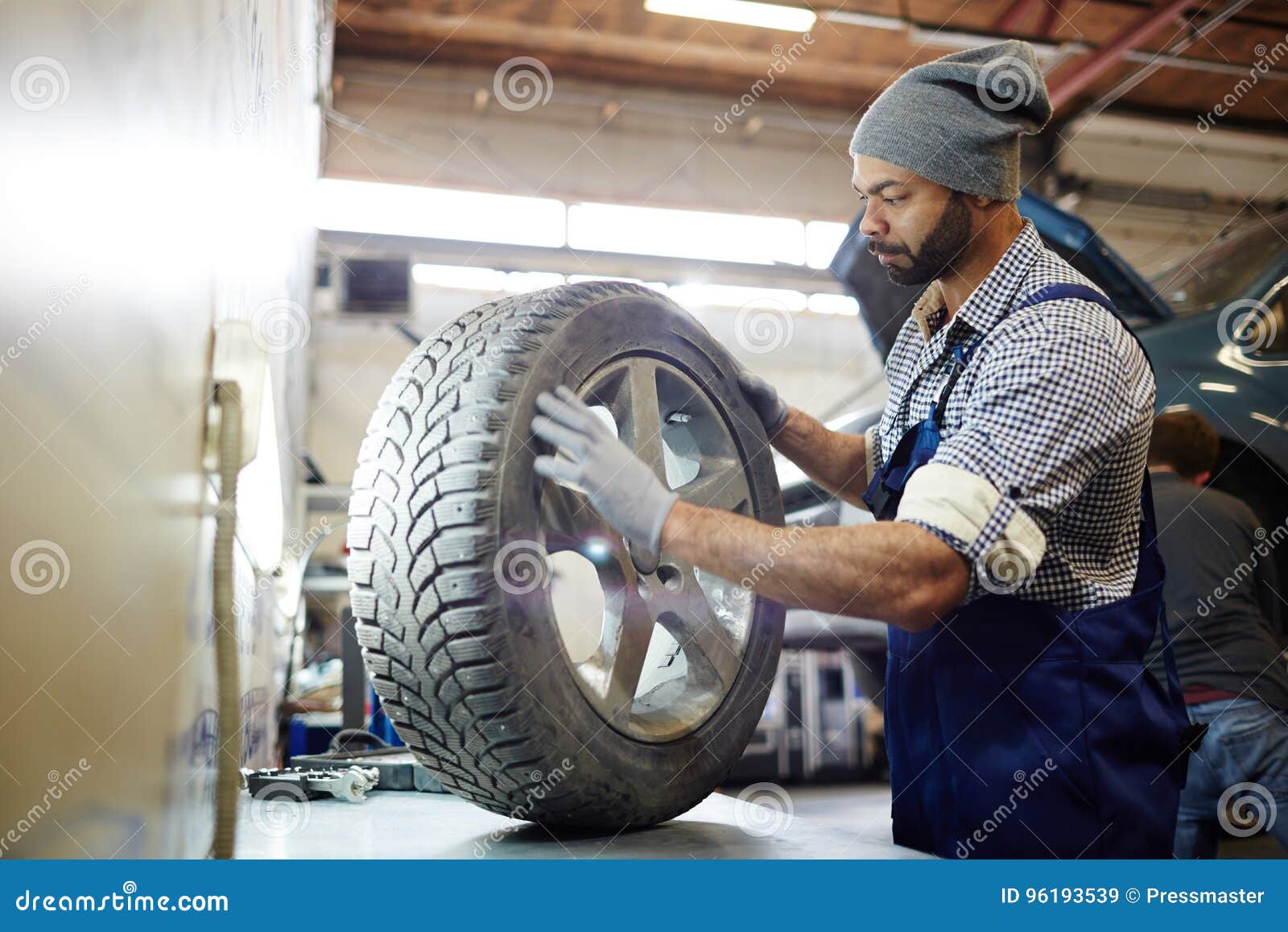 Tire change service stock image. Image of small, occupation 96193539