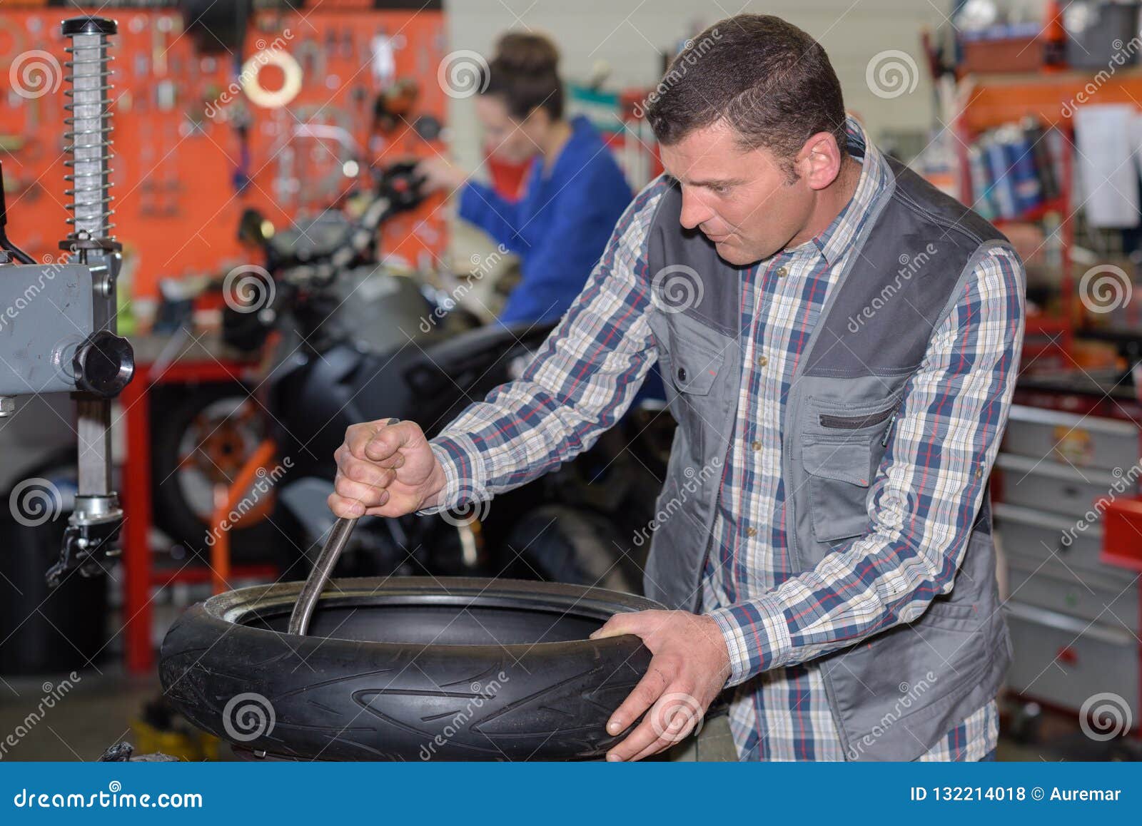 Tire fitter at work stock photo. Image of spare, automotive 132214018