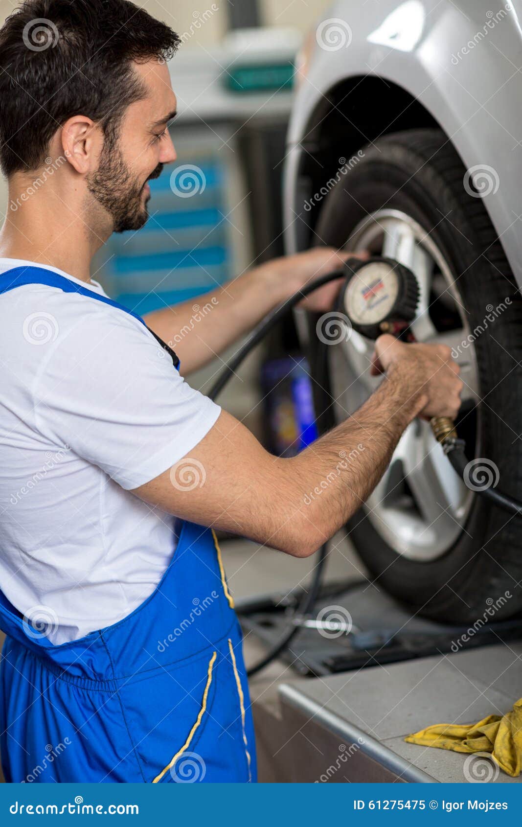 Tire pressure check stock image. Image of meter, male 61275475