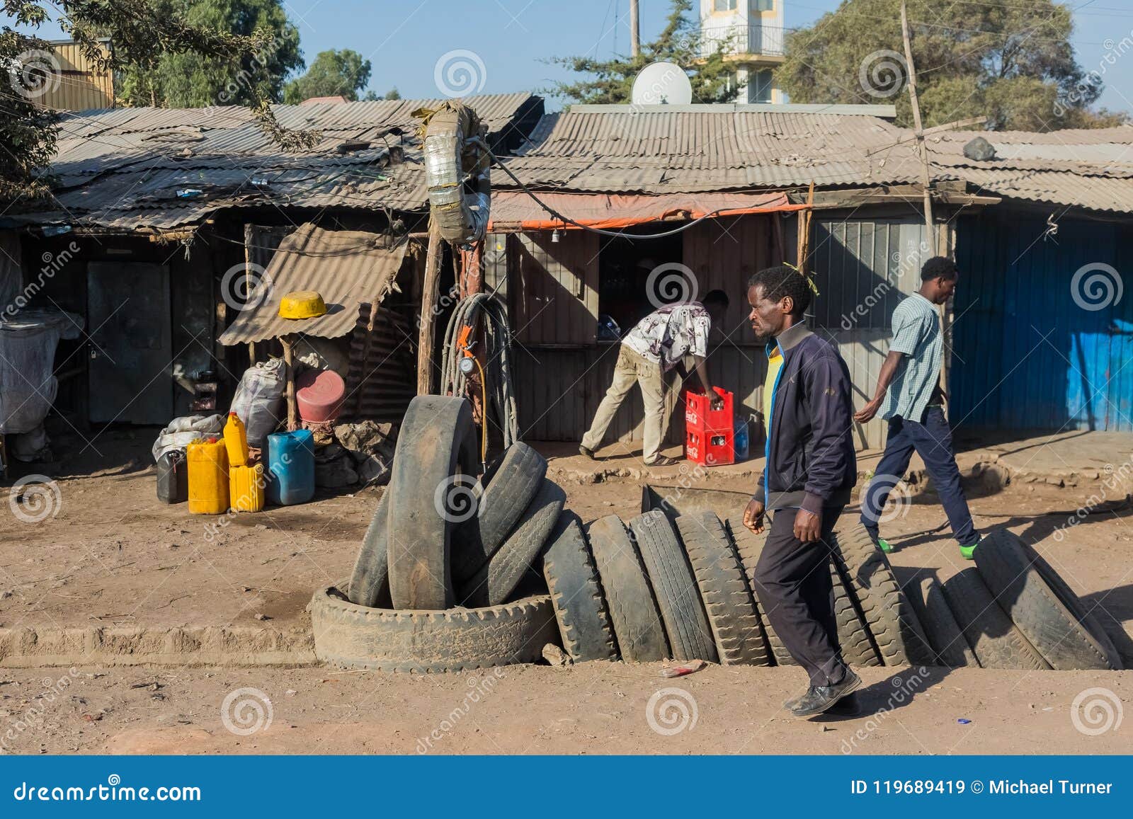tire-salesman-on-a-busy-street-with-various-informal-shops-in-th-editorial-stock-image-image