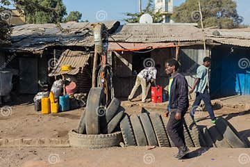 Tire Salesman On A Busy Street With Various Informal Shops In Th Editorial Stock Image Image