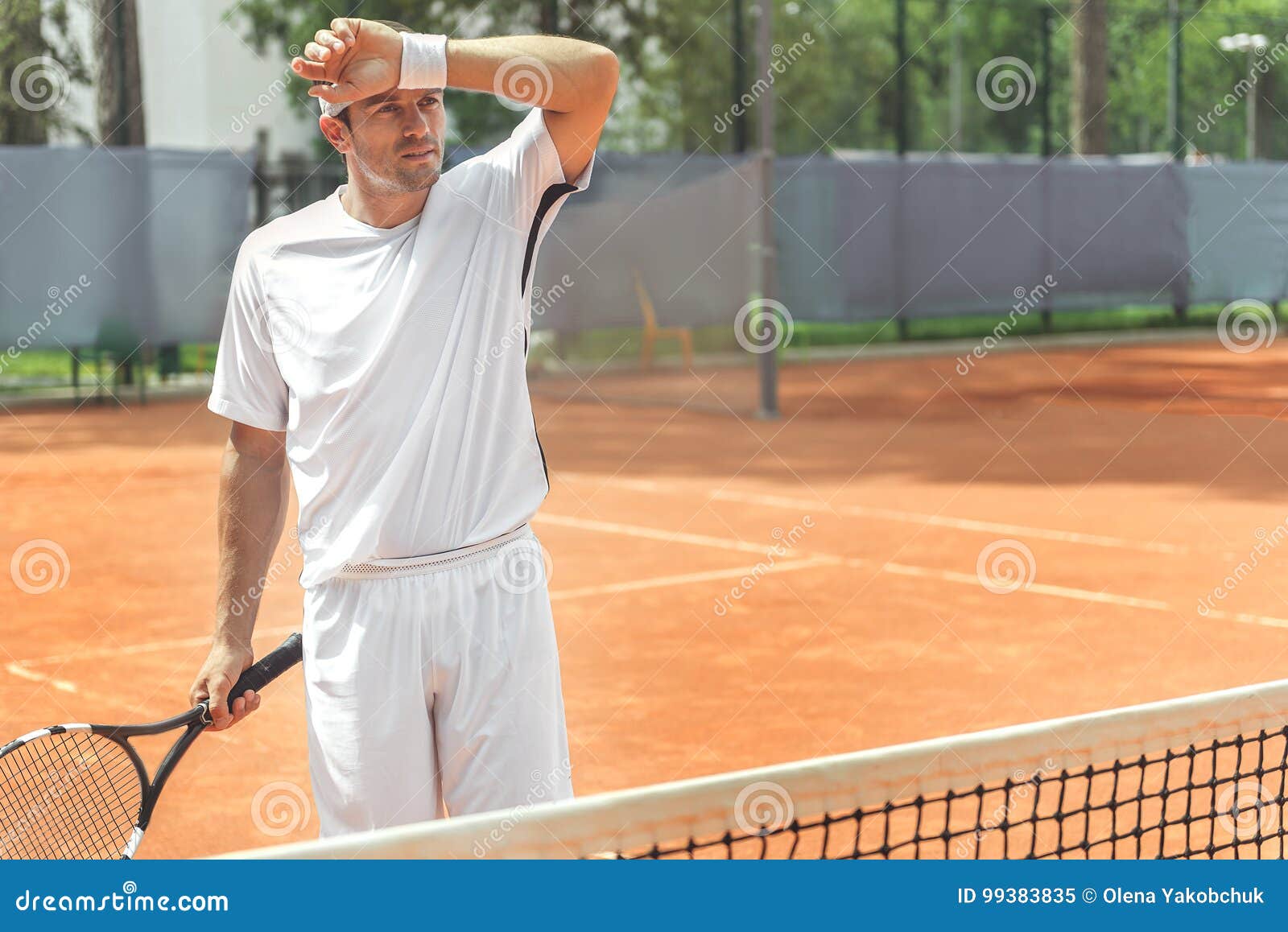 tired adult sportsman on court