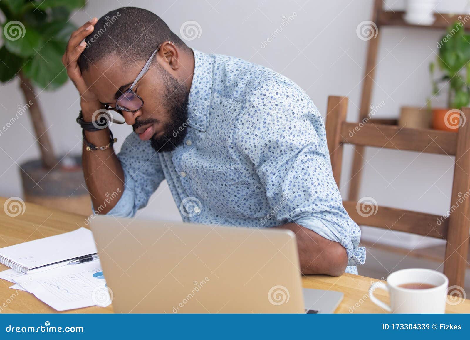 Tired African American Businessman Sitting At Desk Falling Asleep