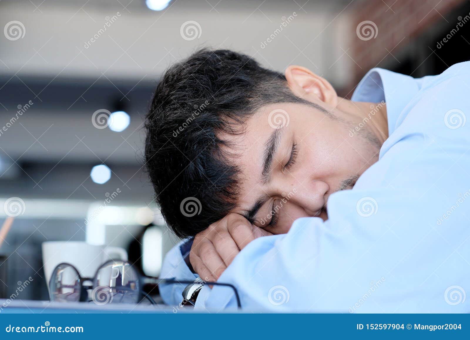 Tired Asian Man Sleeping At Office Desk Young Businessman With