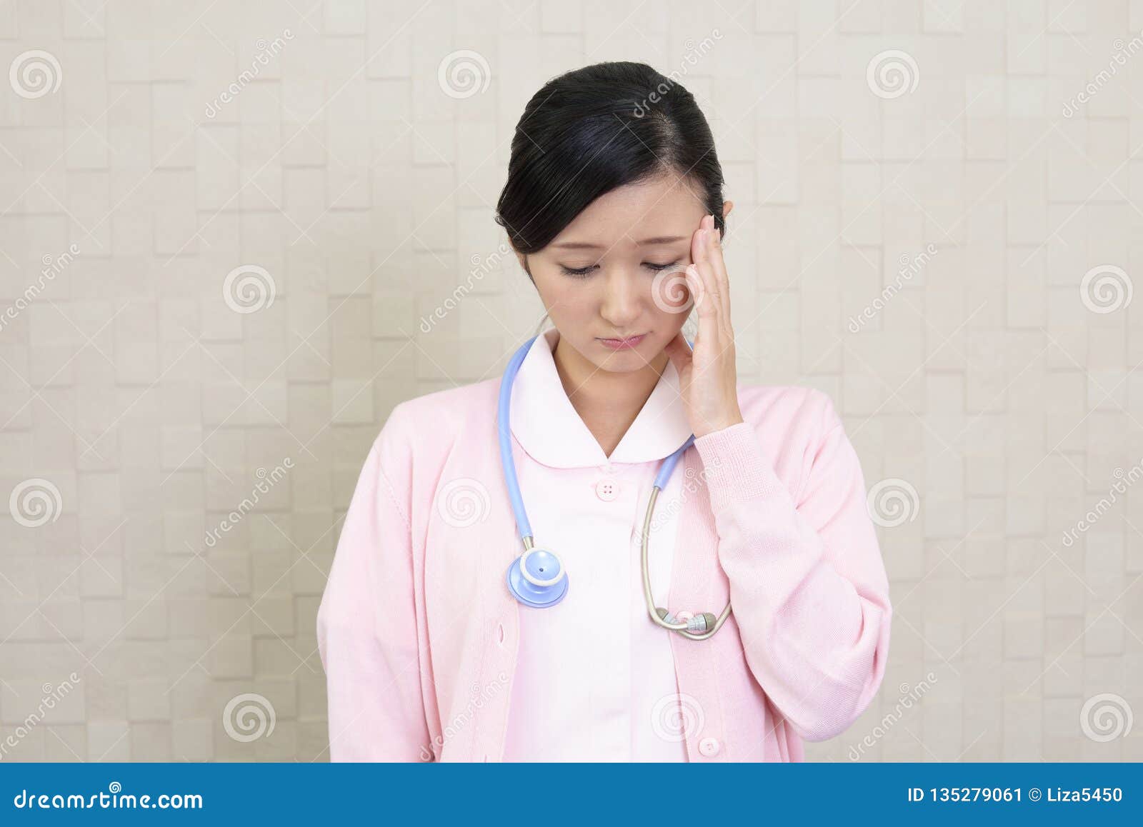 Tired Asian nurse. stock image. Image of frustration 135279061