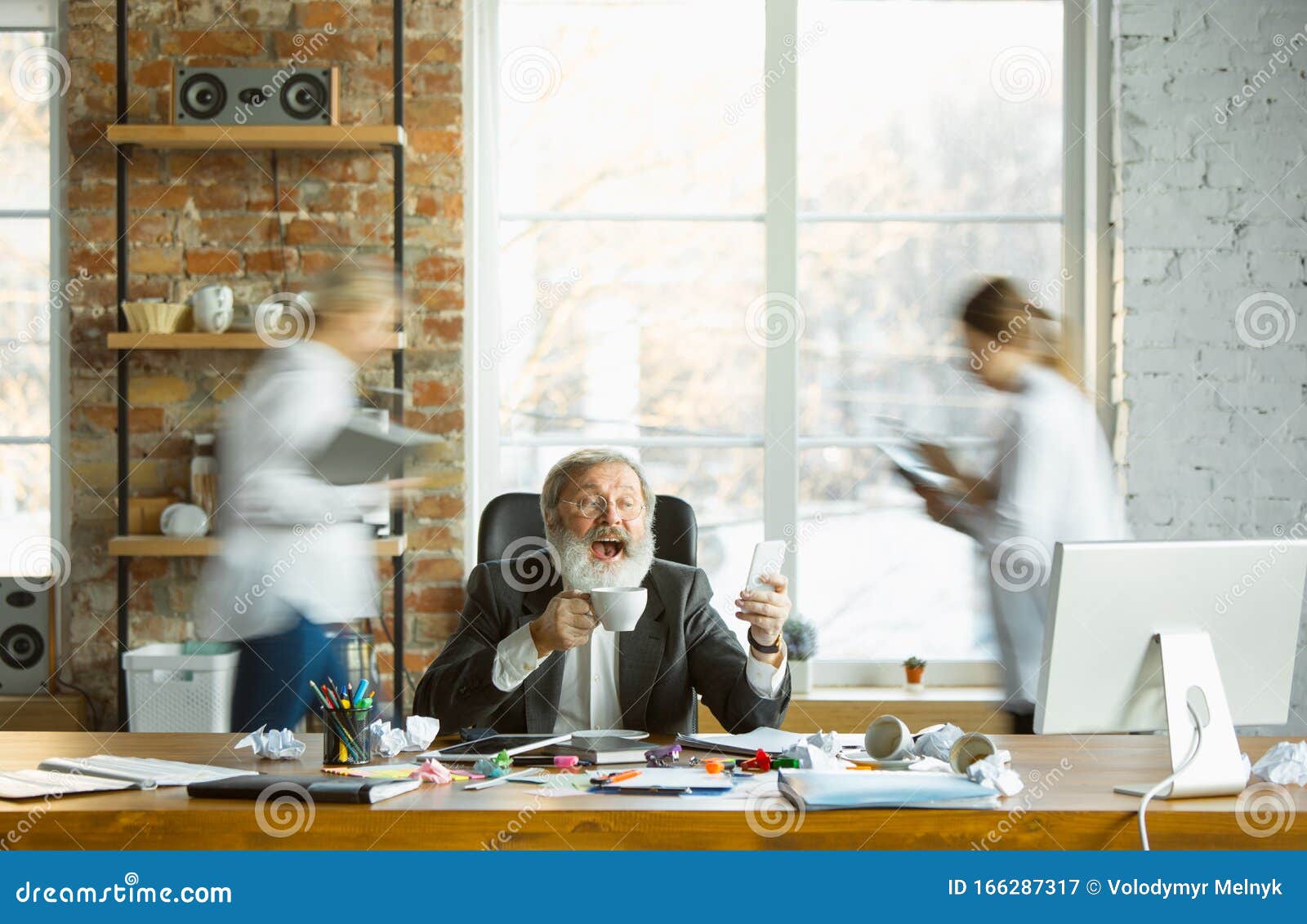 Tired Boss Resting at His Workplace while People Moving Near Blurred