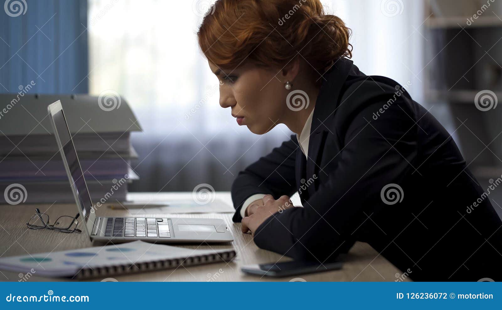 tired business woman working hard all night looking at finished report, deadline