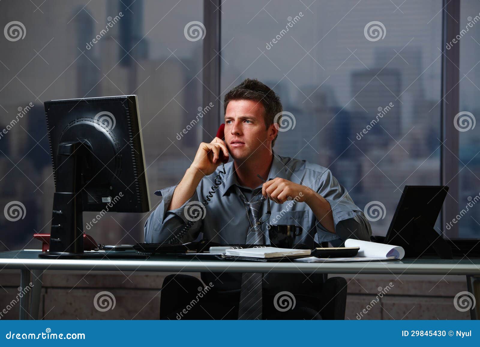 businessman on call working overtime