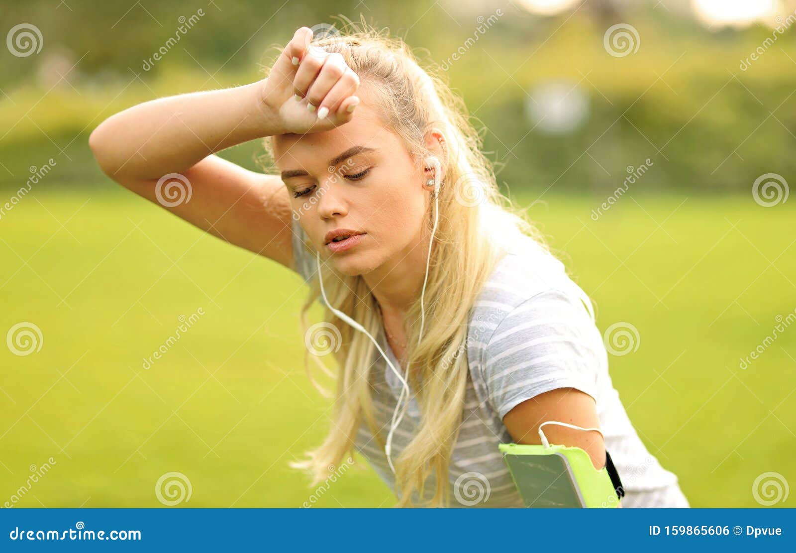 Tired Female Runner In The Park Taking A Break Sporty Woman Breathing And Resting After