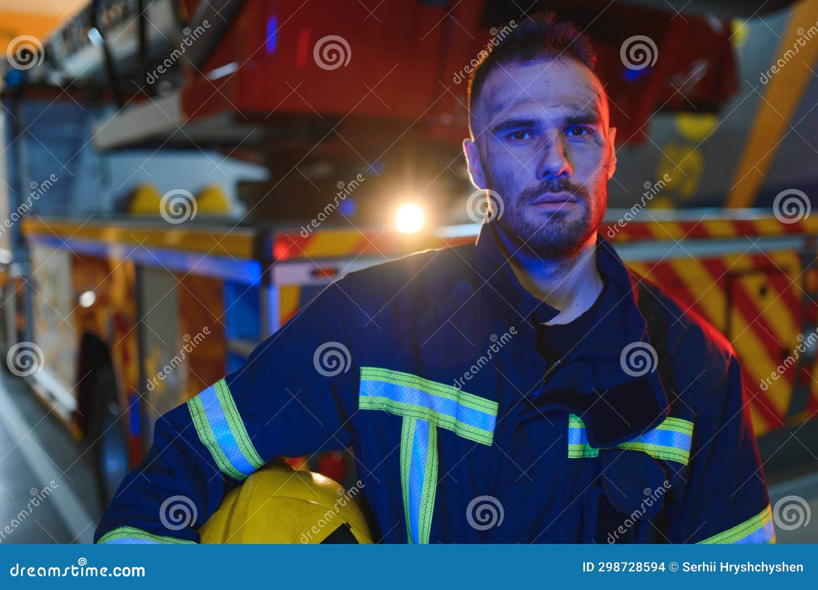 Tired Firefighter after Work in a Fire Department Stock Photo Image