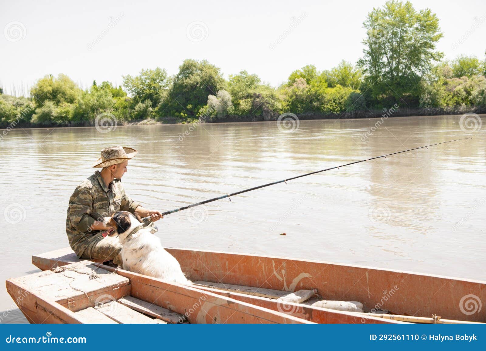 Tired Male Angler with Dog, Holding Fishing Rod, while Sitting in Rowing  Boat in Sunny Day. Stock Photo - Image of calm, weekend: 292561110