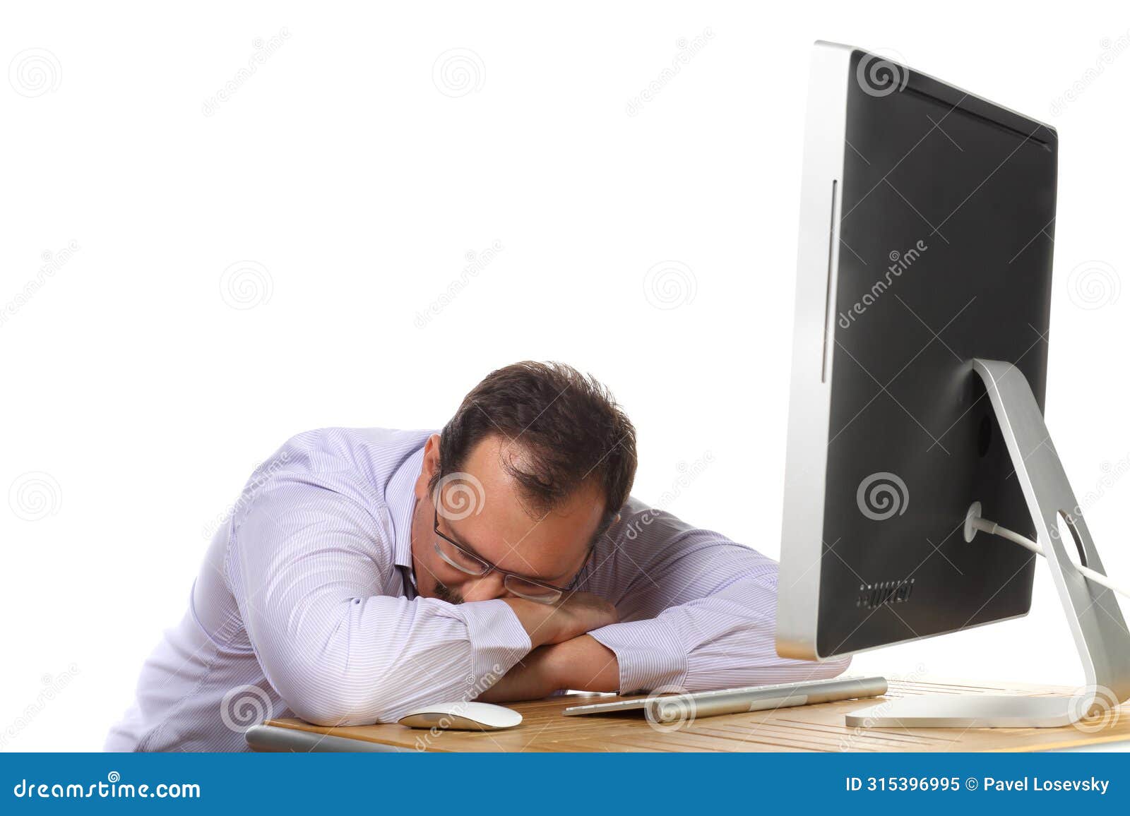 tired man asleep at desk with computer working
