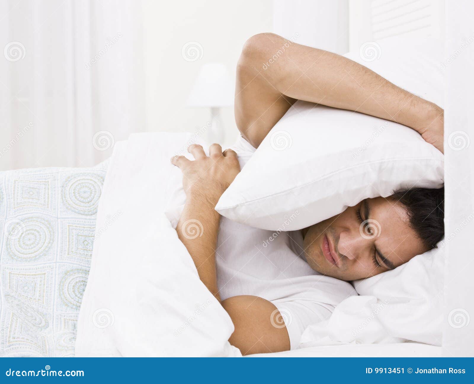 Tired Man Hiding His Head With Pillow Stock Image - Image 