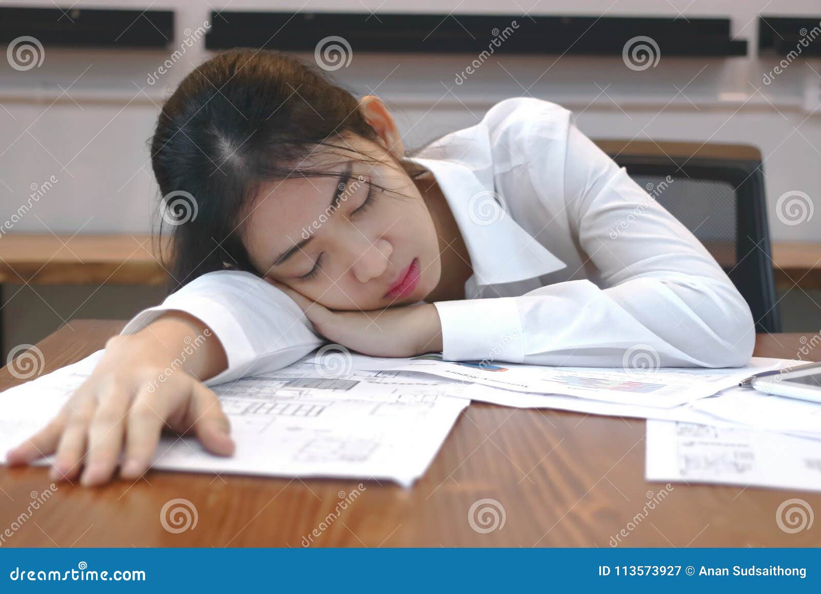 Tired Overworked Young Asian Business Woman Lying Down On The Desk