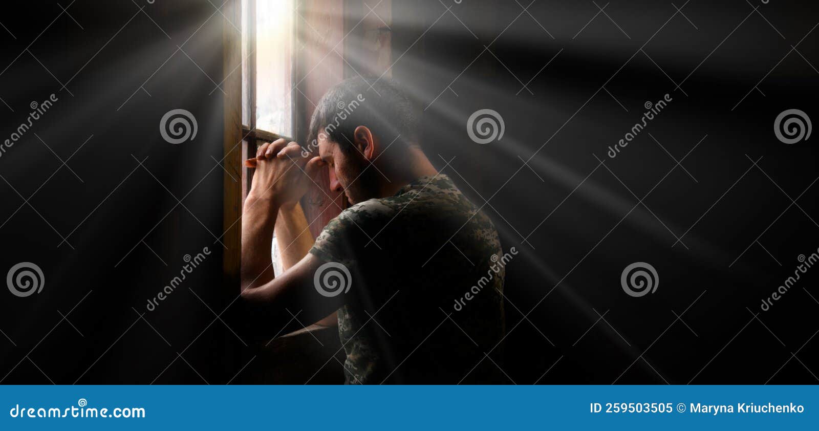 sad soldier praying at the window