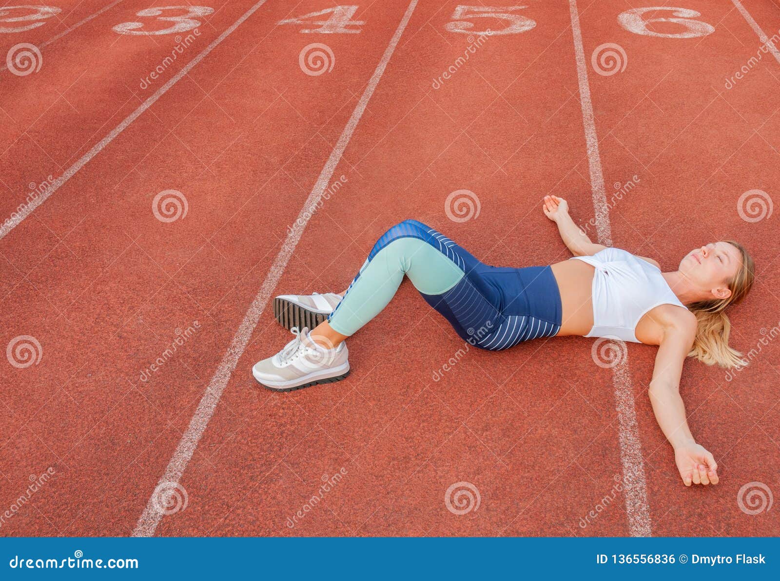 Tired Woman Runner Taking A Rest After Run Lying On The ...