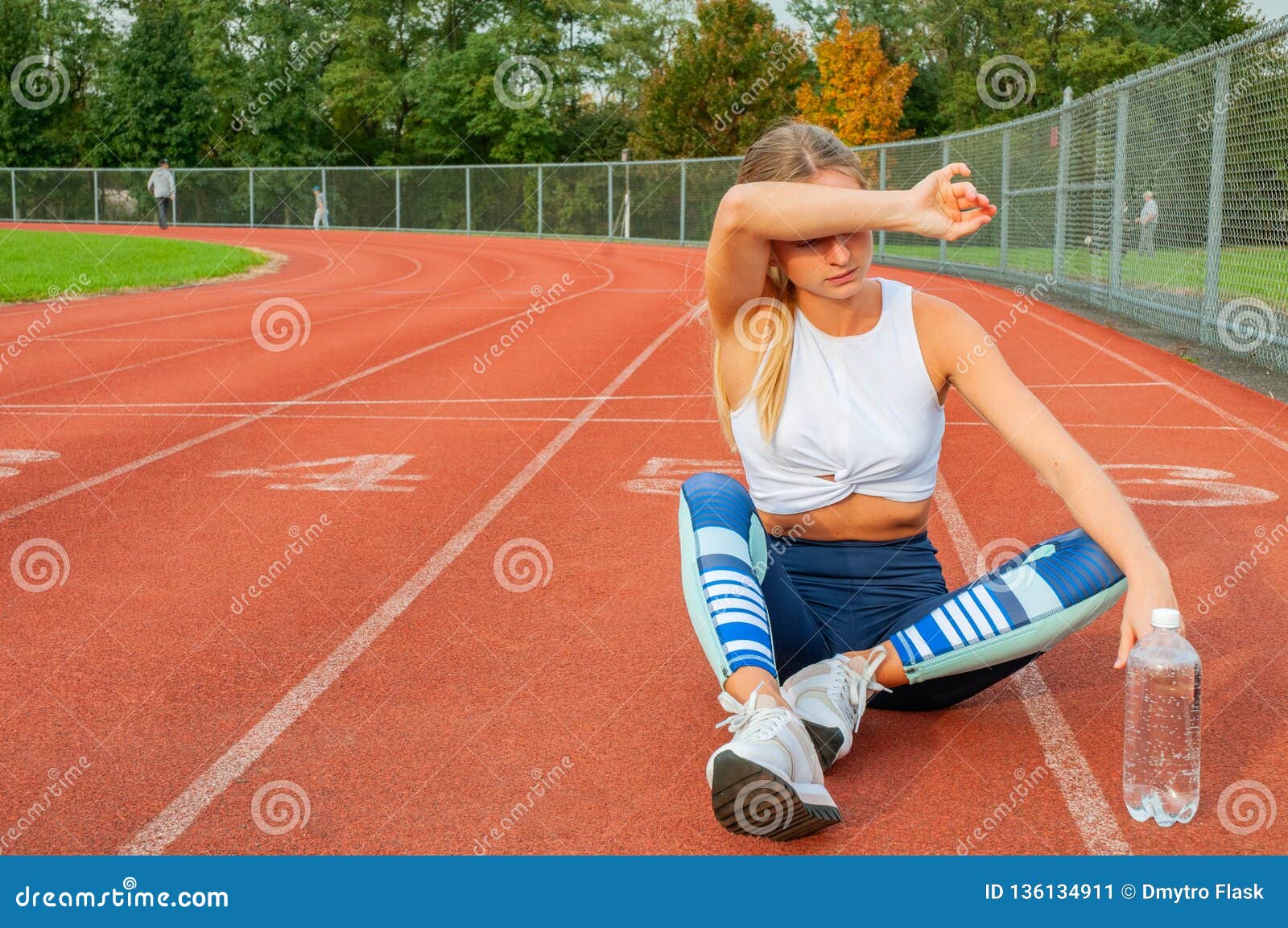 Tired Woman Runner Taking A Rest After Run Sitting On The ...
