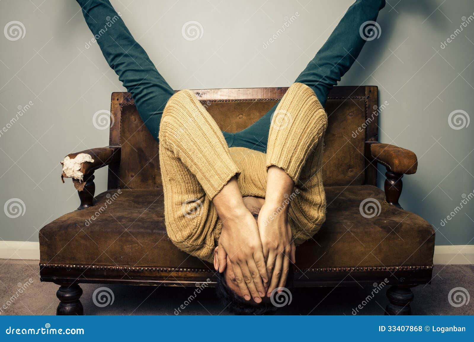 Tired Young Man Is Upside Down On Old Sofa Royalty Free Stock Photos ...