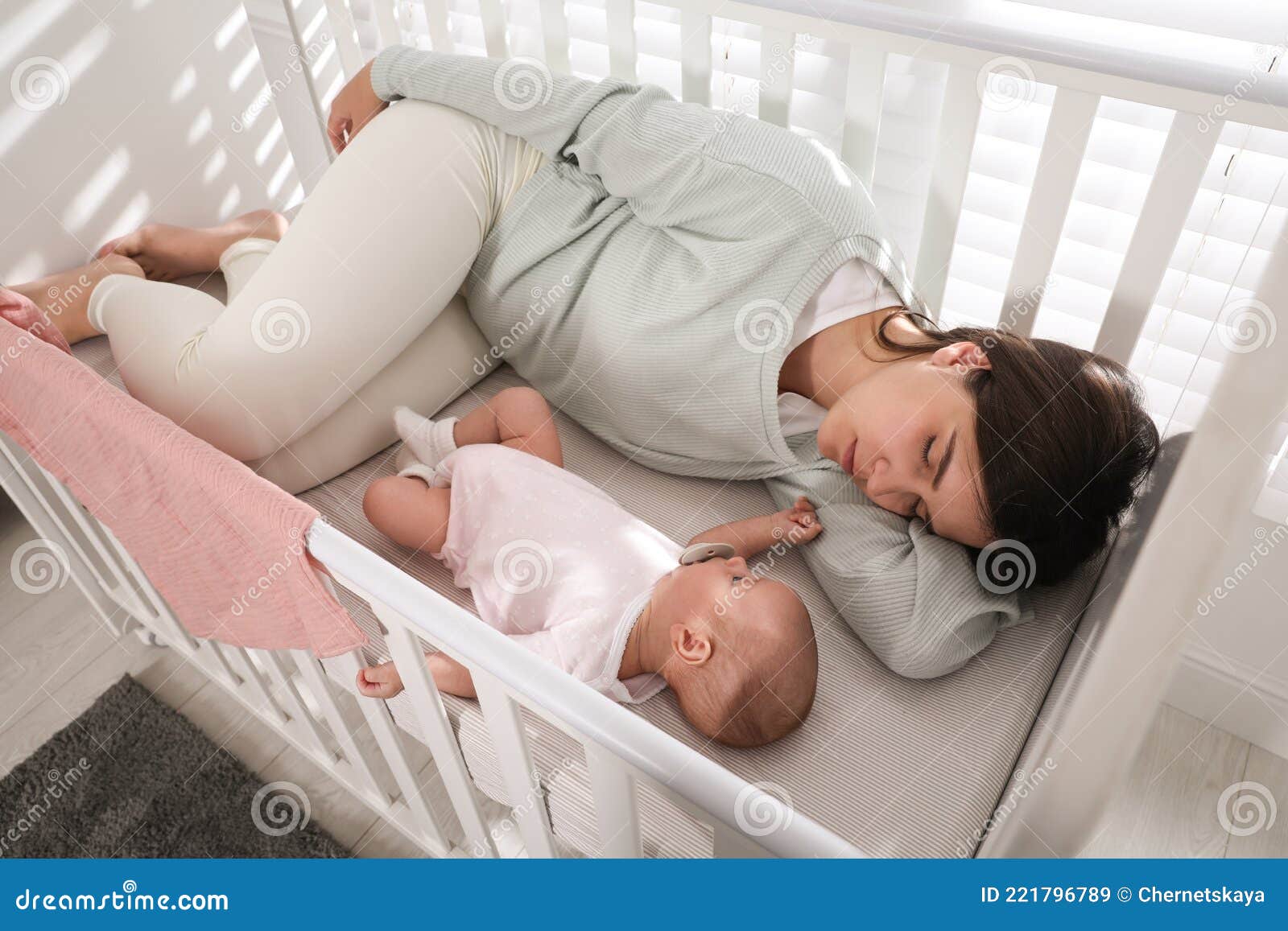 Mother Sleeping In Crib With Baby Online