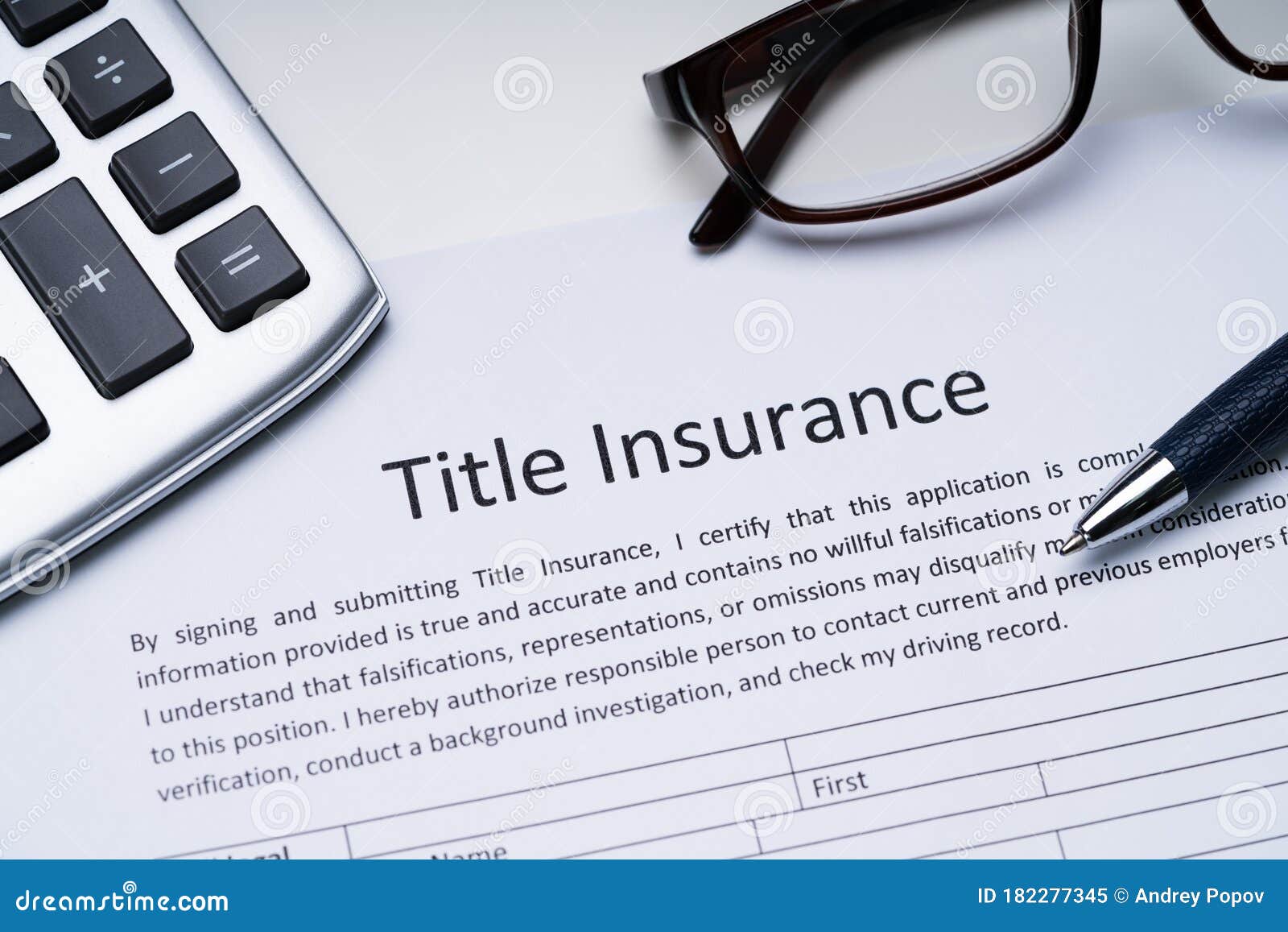 title insurance form over white desk
