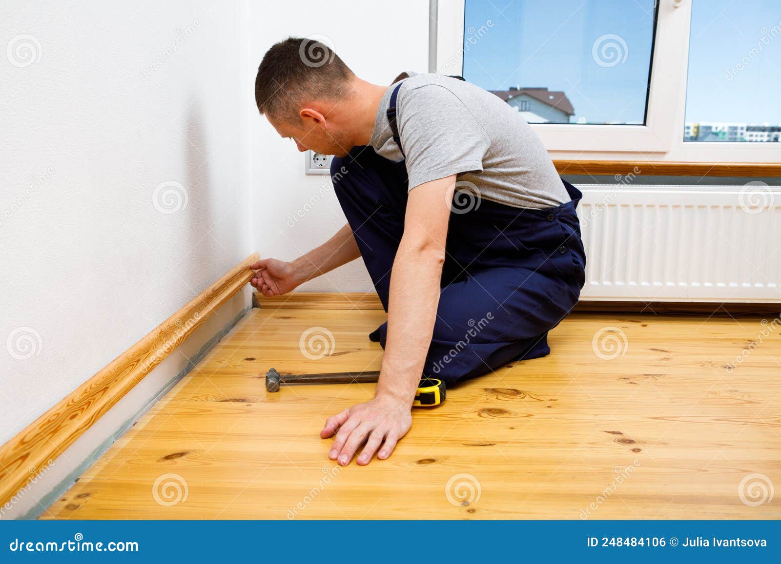 To Make Repairs. Installing a New Skirting Board Stock Photo Image of