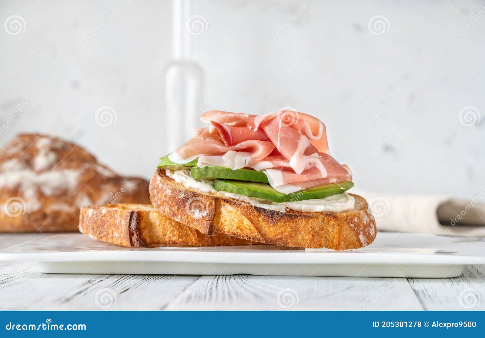 Toast with Avocado, Prosciutto and Cream Cheese Stock Photo Image of