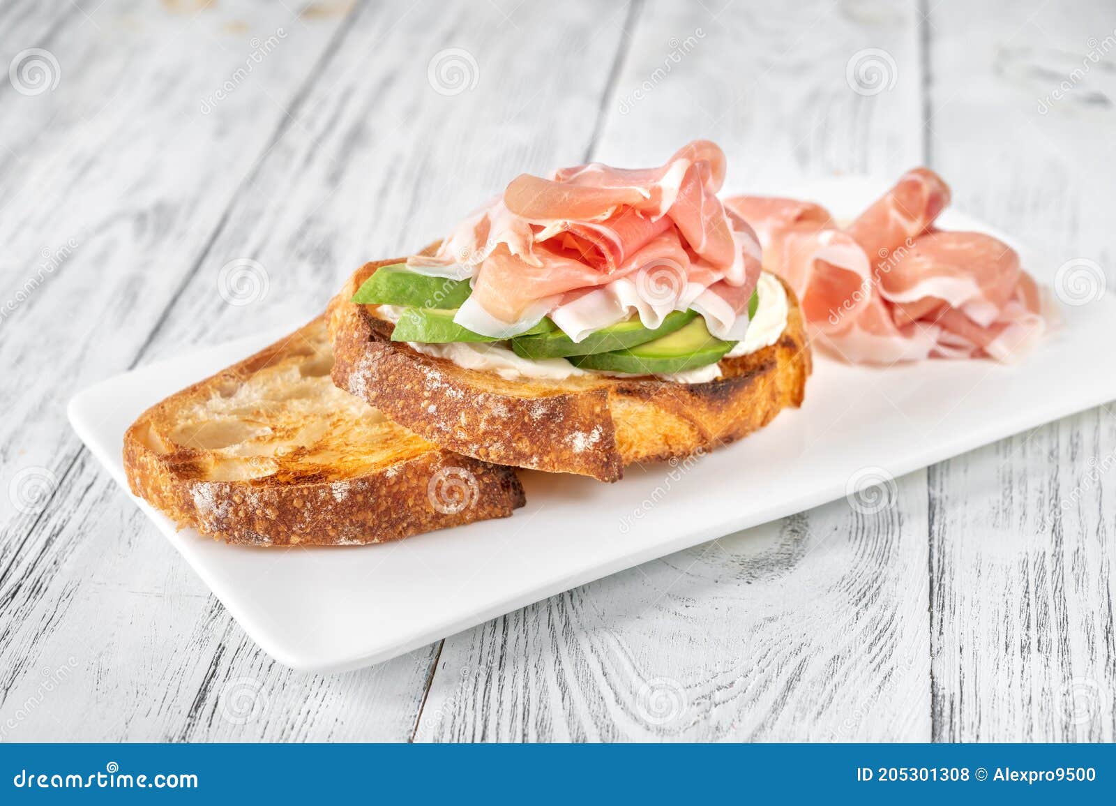 Toast with Avocado, Prosciutto and Cream Cheese Stock Photo Image of