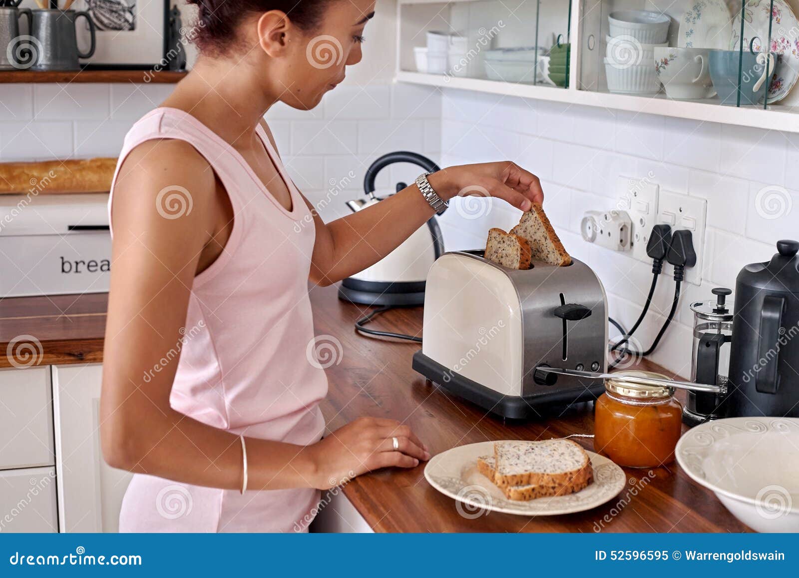 Toast woman kitchen stock image. Image of healthy, slices 52596595