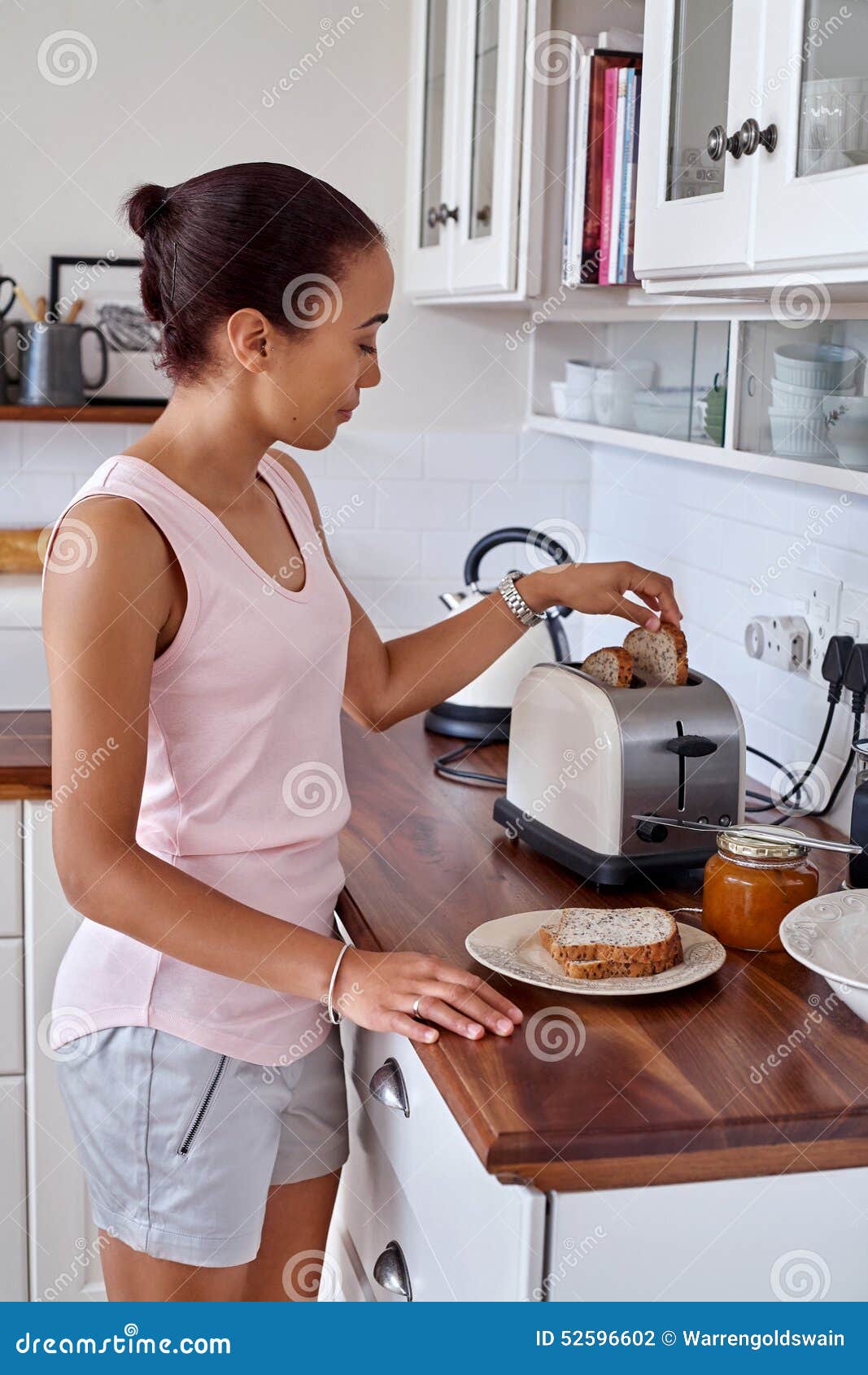    https://thumbs.dreamstime.com/z/toast-woman-kitchen-young-making-breakfast-bread-toaster-home-52596602.jpg   