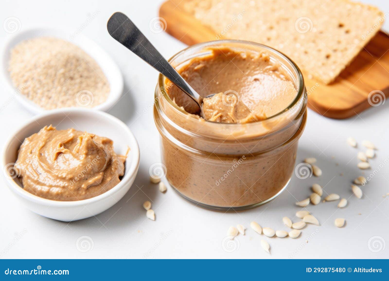Toasted Bread Slice, Almond Butter Spread, and Spoon Stock Photo