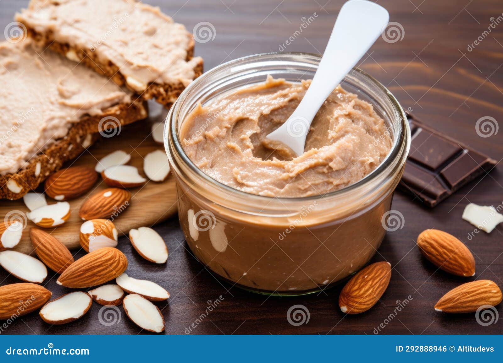 Toasted Bread Slice, Almond Butter Spread, and Spoon Stock Photo