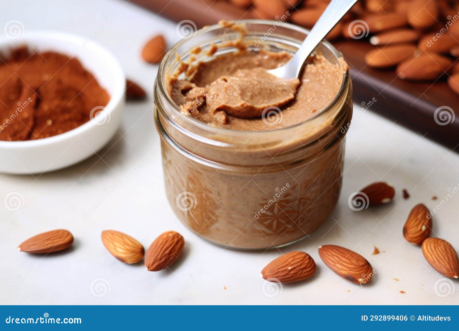 Toasted Bread Slice, Almond Butter Spread, and Spoon Stock Photo