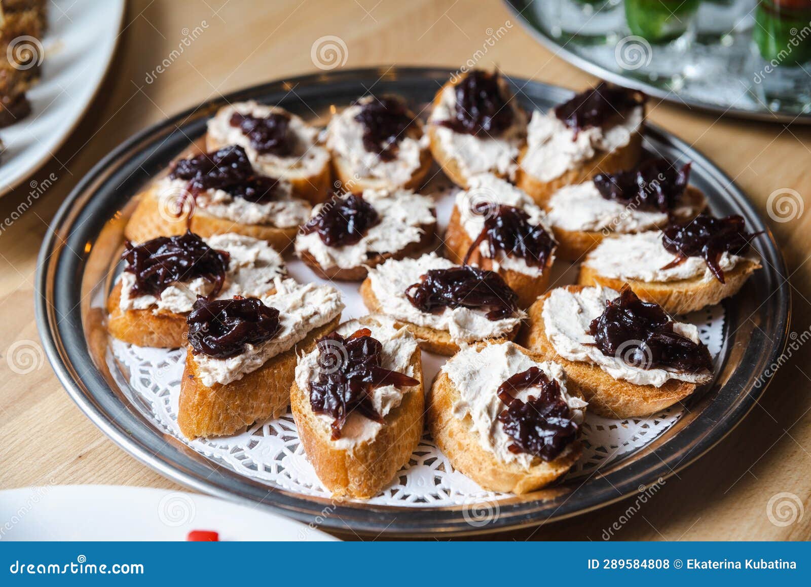 Toasts with Tuna Cream Cheese Spread and Caramelized Onions Stock Photo