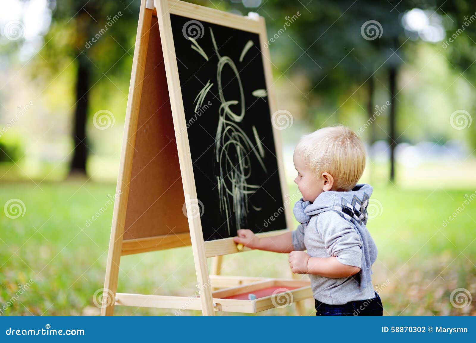 Toddler Boy Drawing Standing by a Blackboard Stock Photo Image of
