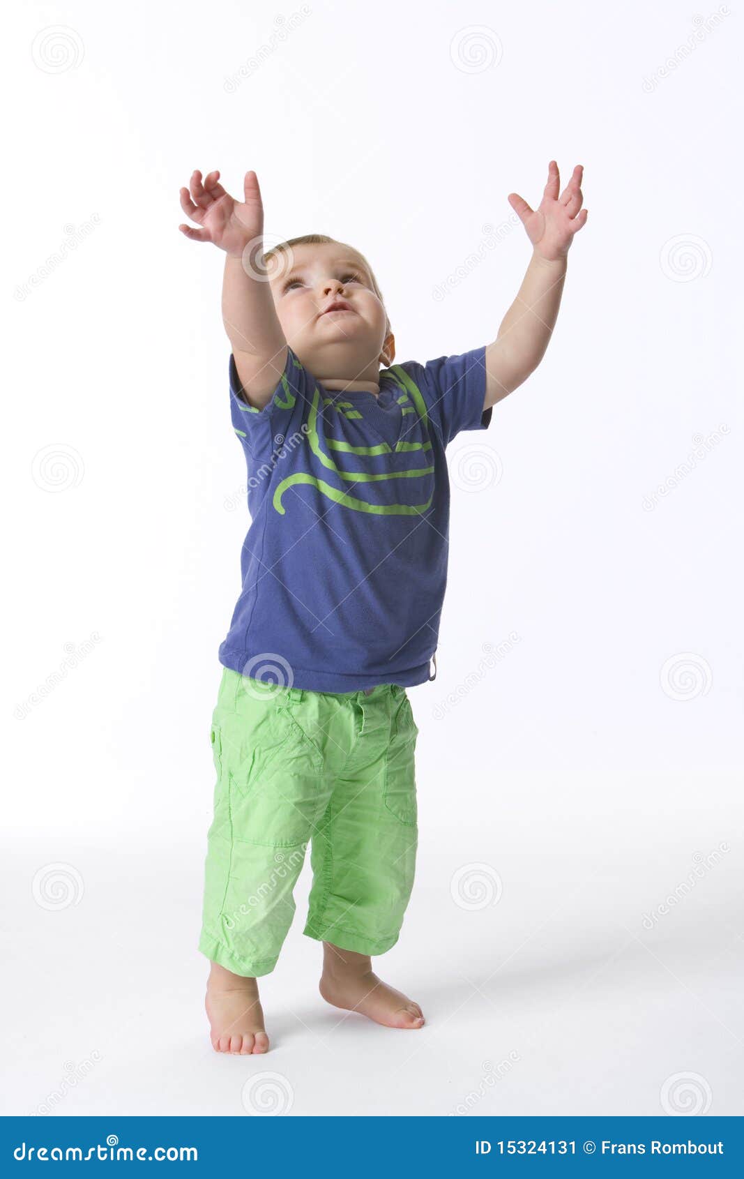 toddler boy reaching above