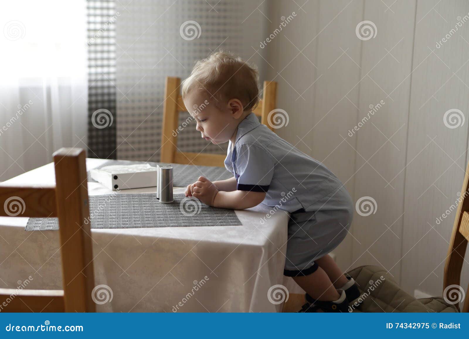 Toddler at dinner table stock image. Image of human, feeding - 74342975