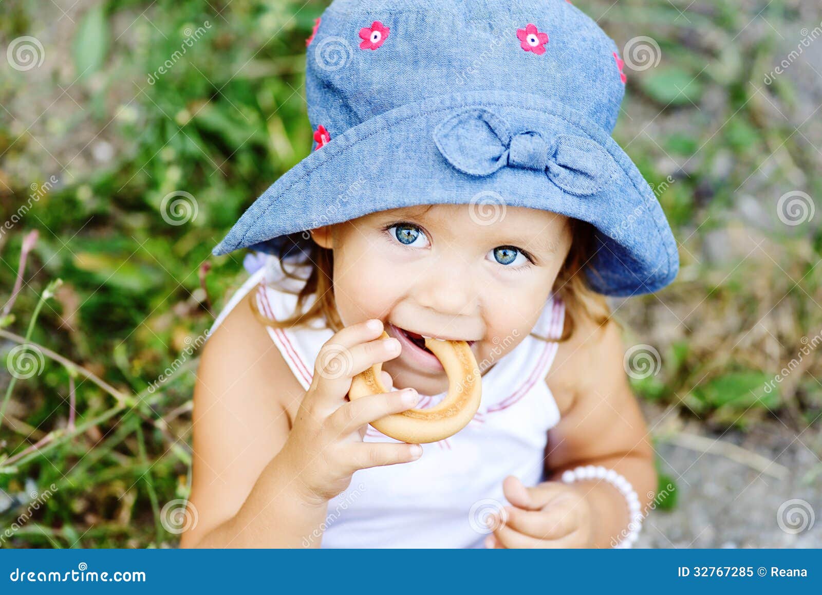 toddler girl eating cracknel