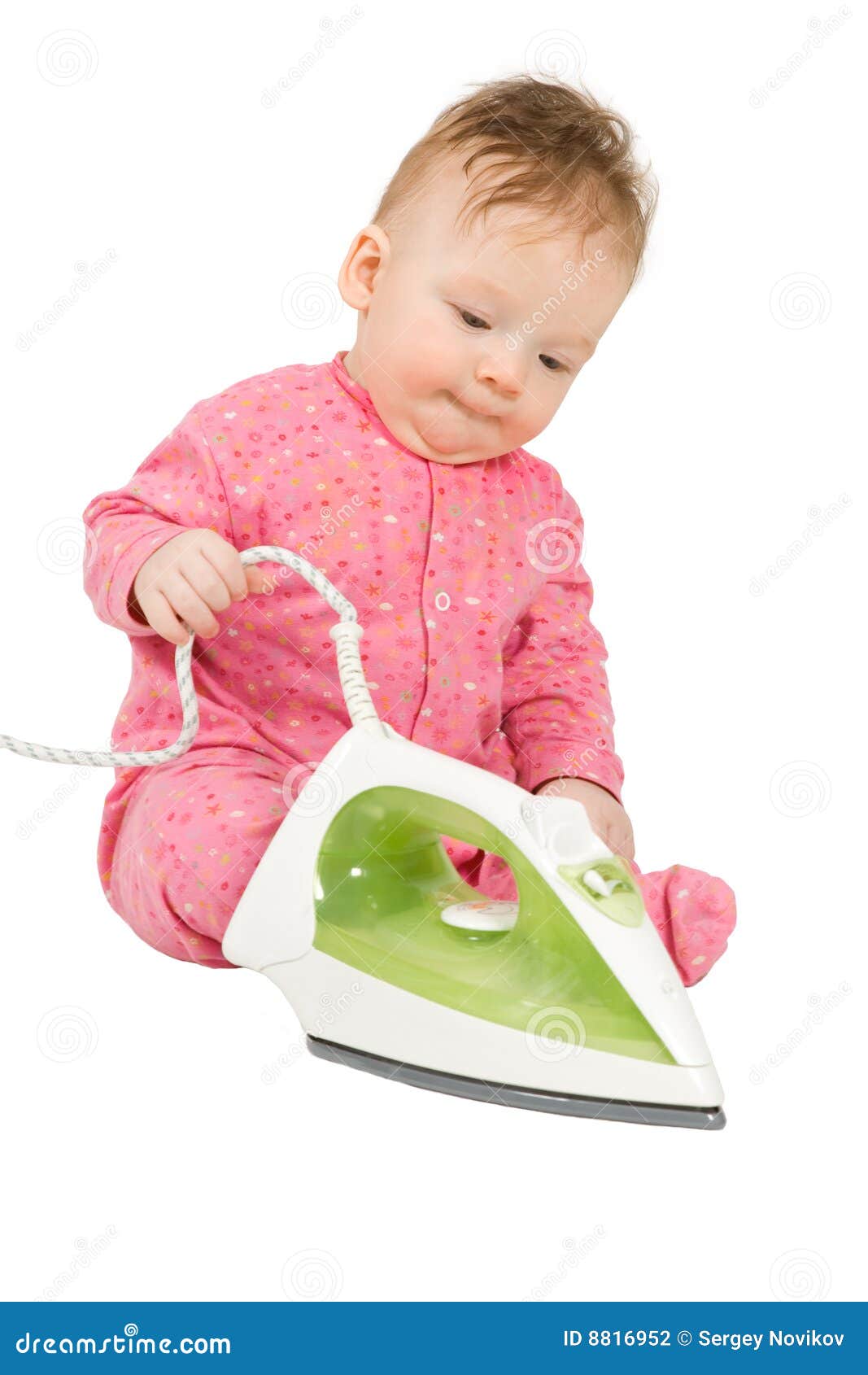 toddler playing with smoothing iron