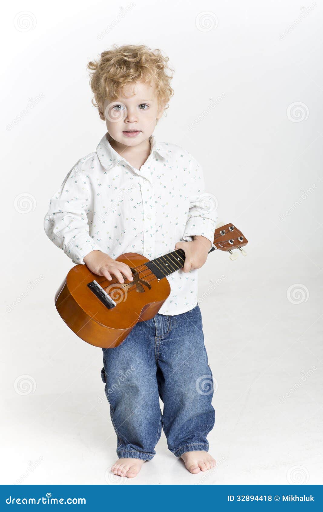 Toddler is Playing on Ukulele on White Stock Photo Image of solo