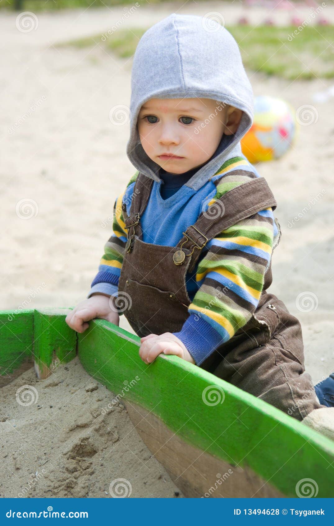 Toddler Sitting Near Sandbox Stock Photo Image of sandpit, sadness