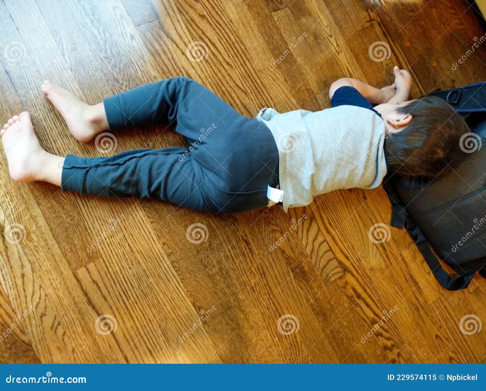 toddler sleeping on floor