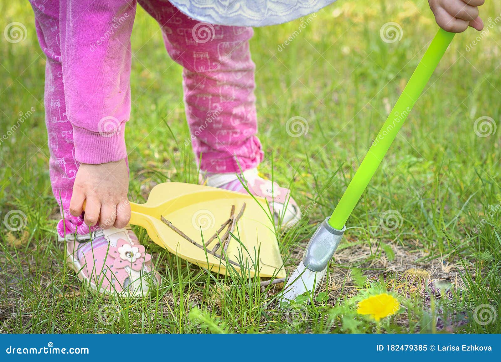 https://thumbs.dreamstime.com/z/toddler-sweeping-trash-green-lawn-selective-focus-182479385.jpg